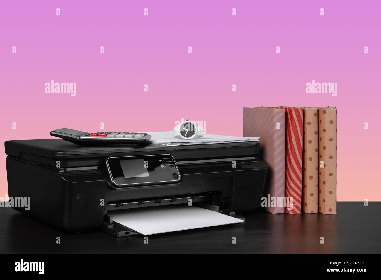 Compact home laser printer against pink background Stock Photo