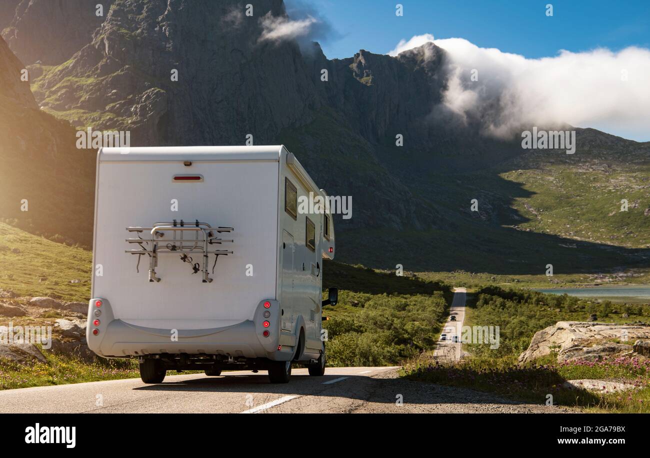 Modern Class C Camper Van RV on the Lofoten Road Trip During Summer Road Trip. Sunny Day in the Archipelago Stock Photo