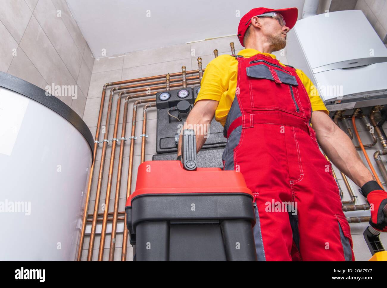 Residential HVAC Service Worker Performing Natural Gas Heating System Check. Caucasian