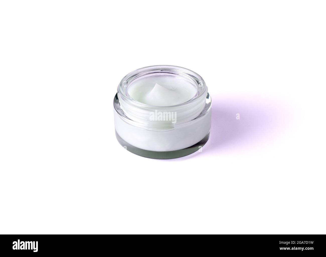 Glass jar with body cream on white background. Transparent jar with