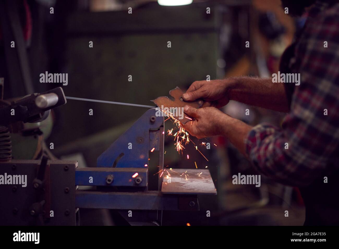 Male Blacksmith Shaping Metalwork 