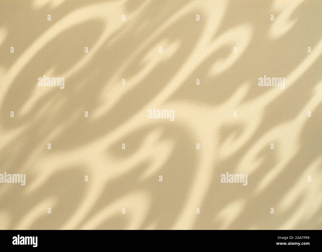 Light yellow background with shadows. Abstract ornamental shadows pattern. Elegant exotic background. Close up. Stock Photo