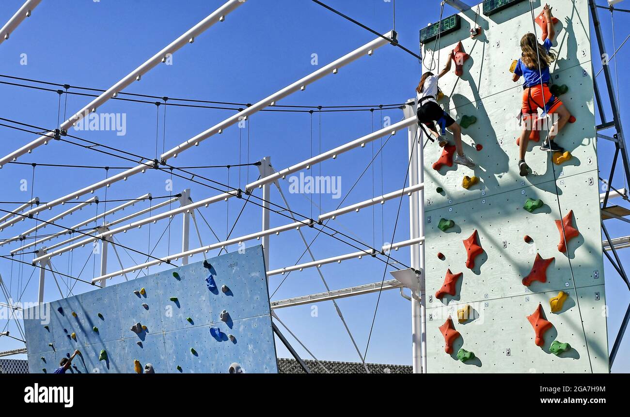 Practicing on a climbing wall, during a sports summer camp, in Milan. Stock Photo