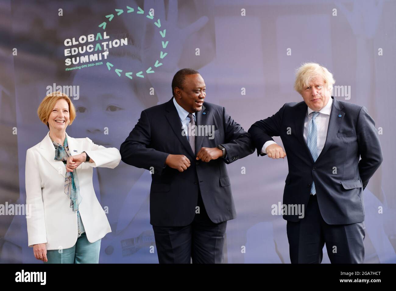 Prime Minister Boris Johnson (right) alongside Kenyan President Uhuru Kenyatta (centre) and former PM of Australia Julia Gillard (left) during a London-based summit to raise funds for the Global Partnership for Education (GPE). Picture date: Thursday July 29, 2021. Stock Photo