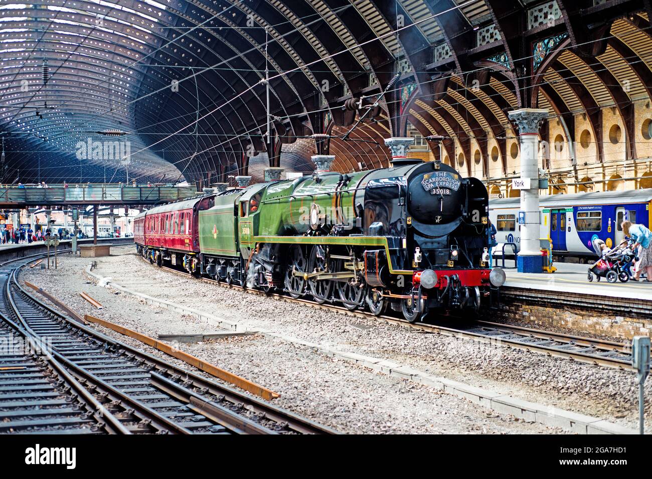 Merchant Navy Class No 35018 British India Line pulling into York Railway Station with the Scarborough Spa Express, England, 29th July 2021 Stock Photo