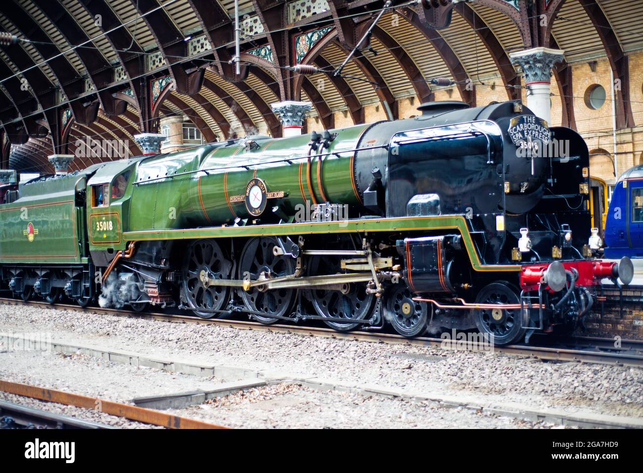 Merchant Navy Class no 35018 British India Line with the Scarborough spa Express at York Railway Station, York, England, 29th July 2021 Stock Photo
