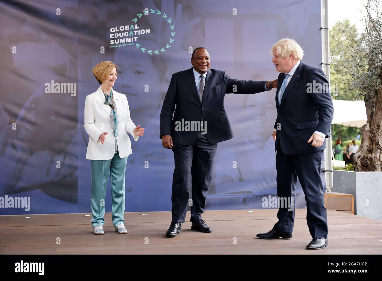 Prime Minister Boris Johnson (right) alongside Kenyan President Uhuru Kenyatta (centre) and former PM of Australia Julia Gillard (left) during a London-based summit to raise funds for the Global Partnership for Education (GPE). Picture date: Thursday July 29, 2021. Stock Photo
