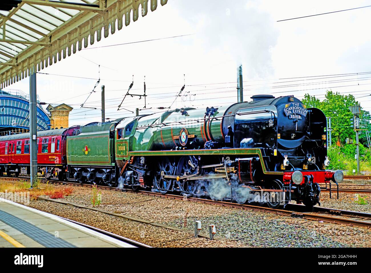 Merchant Navy Class No 35018 British India Line leaving York with the Scarborough Spa Express on 29th July, 2021 Stock Photo