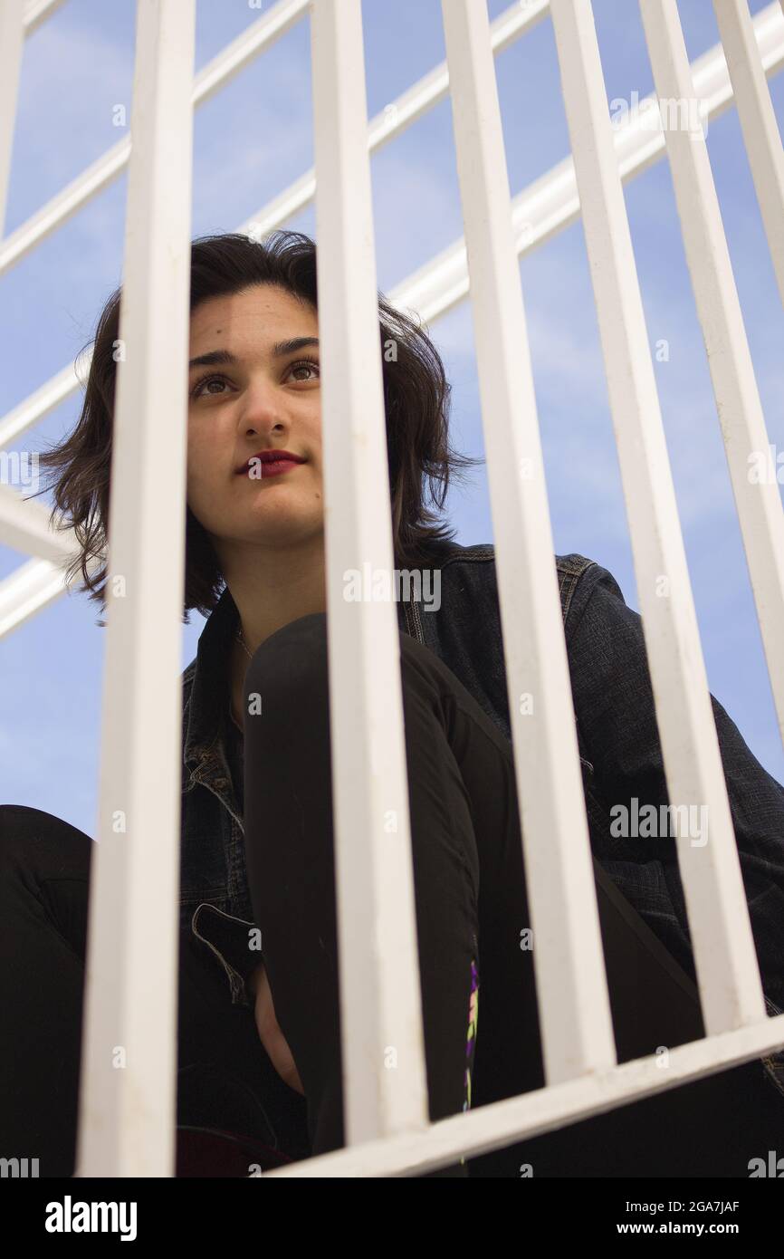 People Standing Behind Railing Woman behind white railings Stock Photo - Alamy