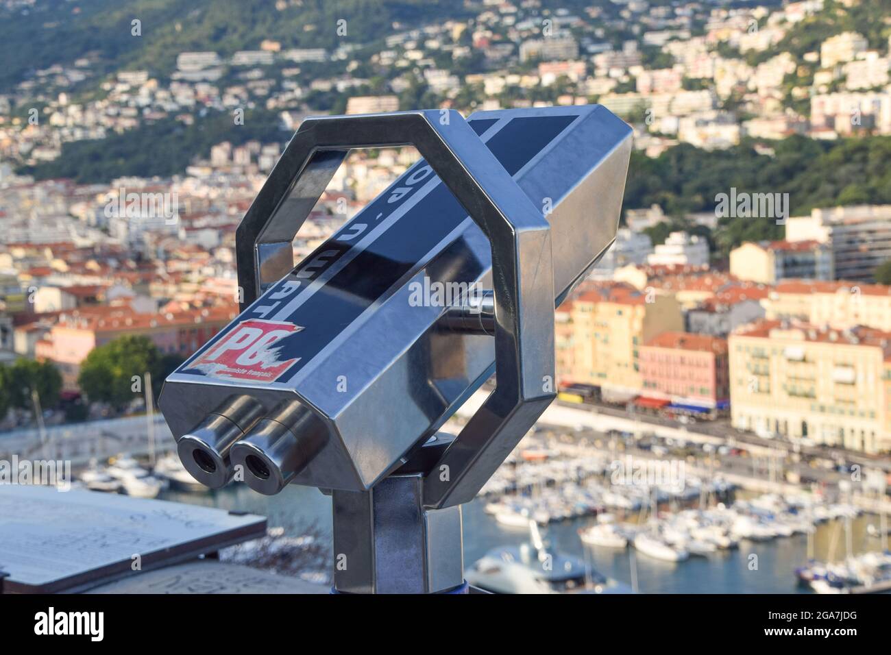 Coin-operated binoculars on Castle Hill with a view of Port Lympia, Nice, South of France. Stock Photo