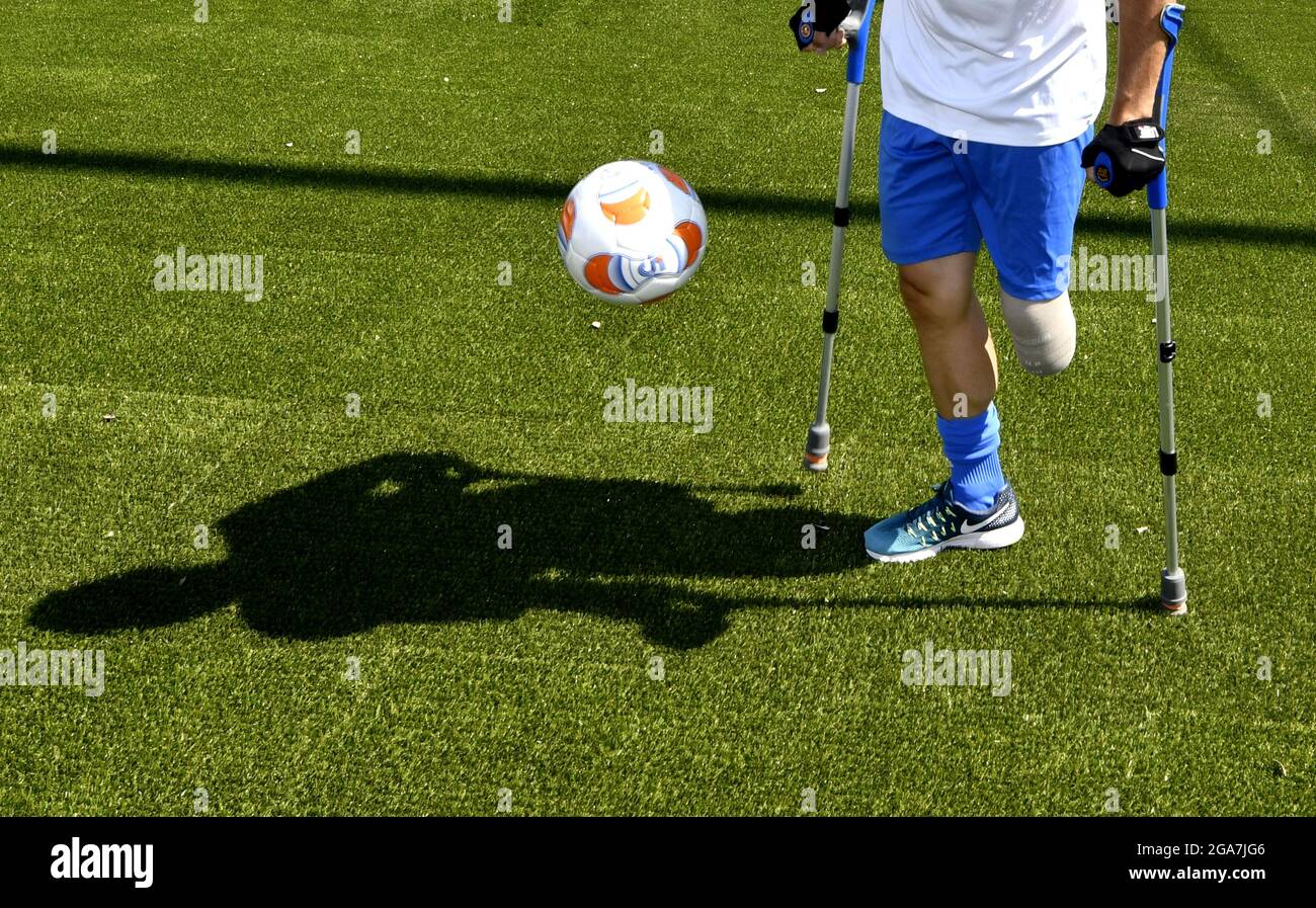Close up of Football with crutches during a friendly match Italy vs England, in Milan. Stock Photo