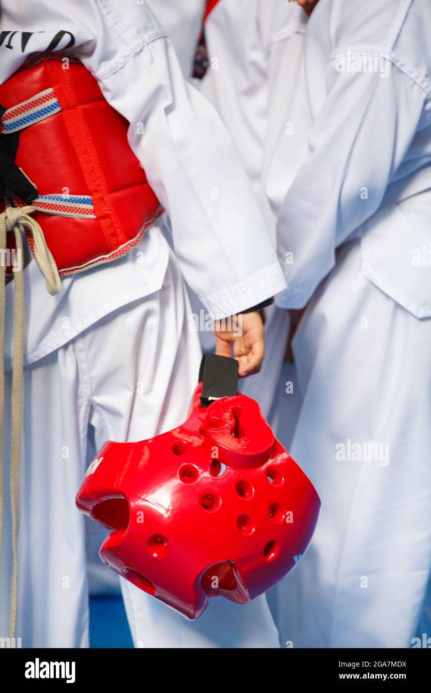 Taekwondo athletes with with uniform and red armour Stock Photo