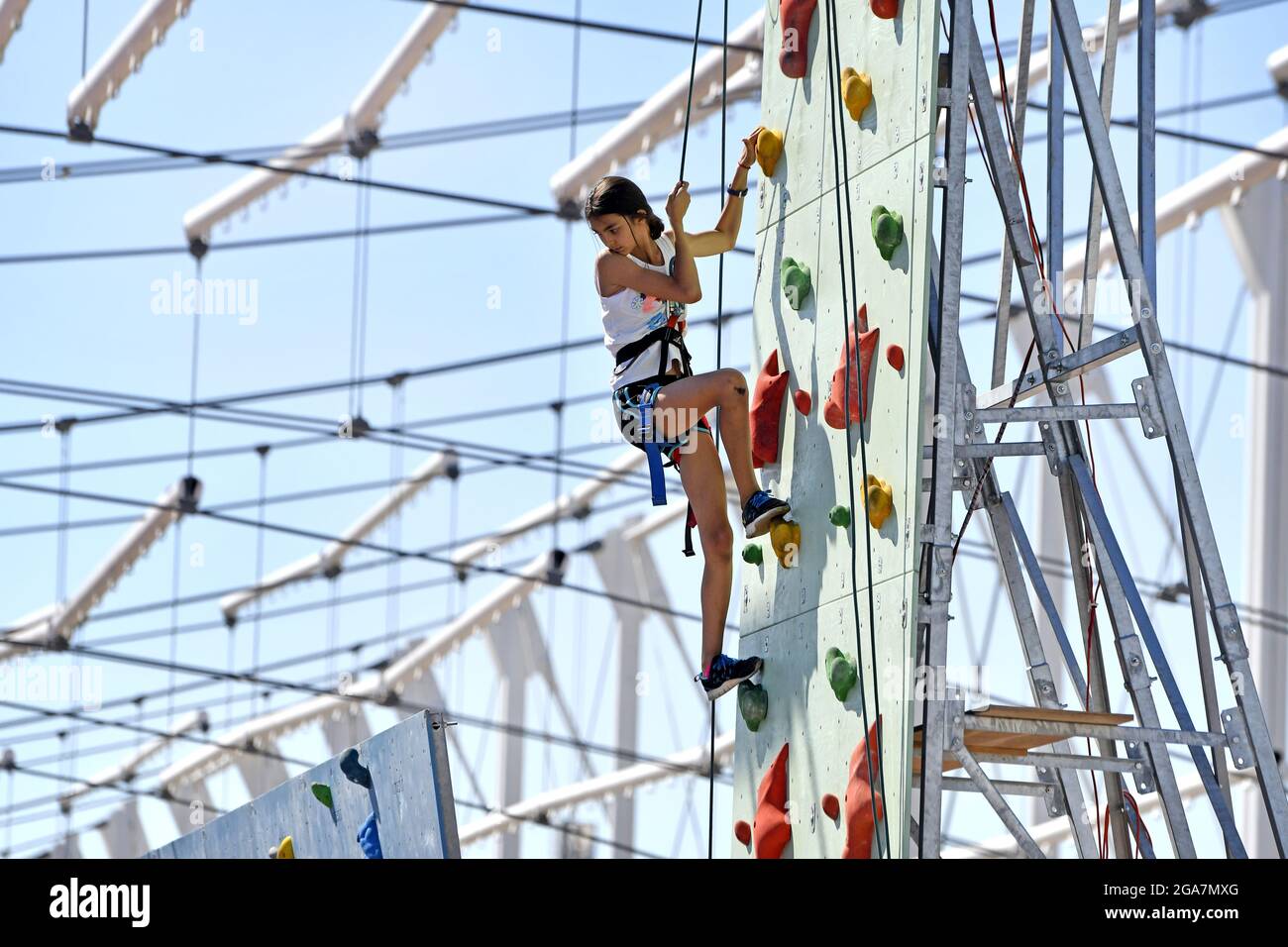 Practicing on a climbing wall, during a sports summer camp, in Milan. Stock Photo