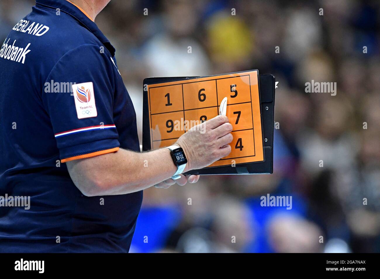 Volleyball's coach holding numerical folder during the Volleyball Men's World Championship 2018, Italy vs Netherlands, in Milan. Stock Photo