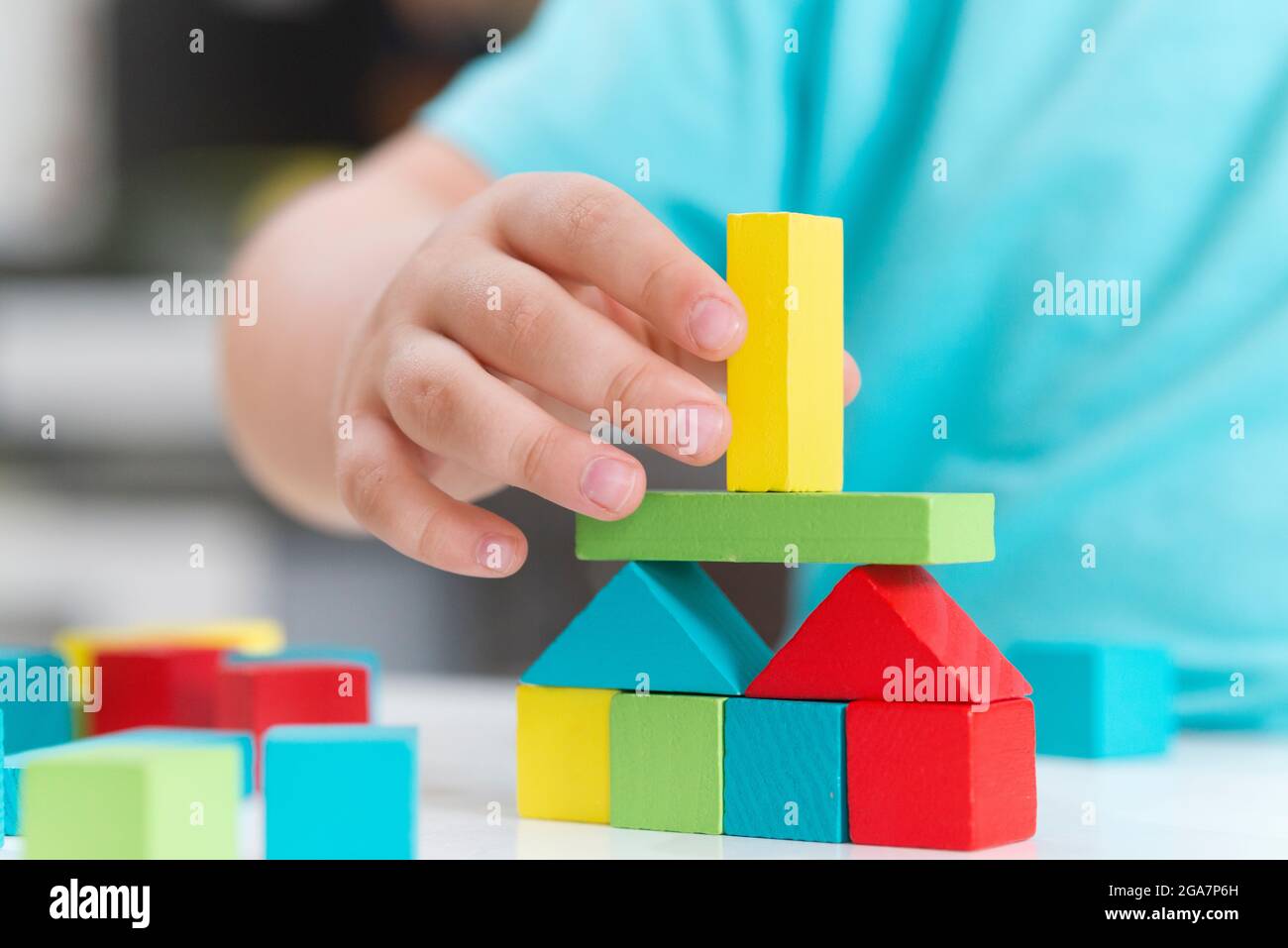 Boy Playing Building Wooden Blocks Stock Photo
