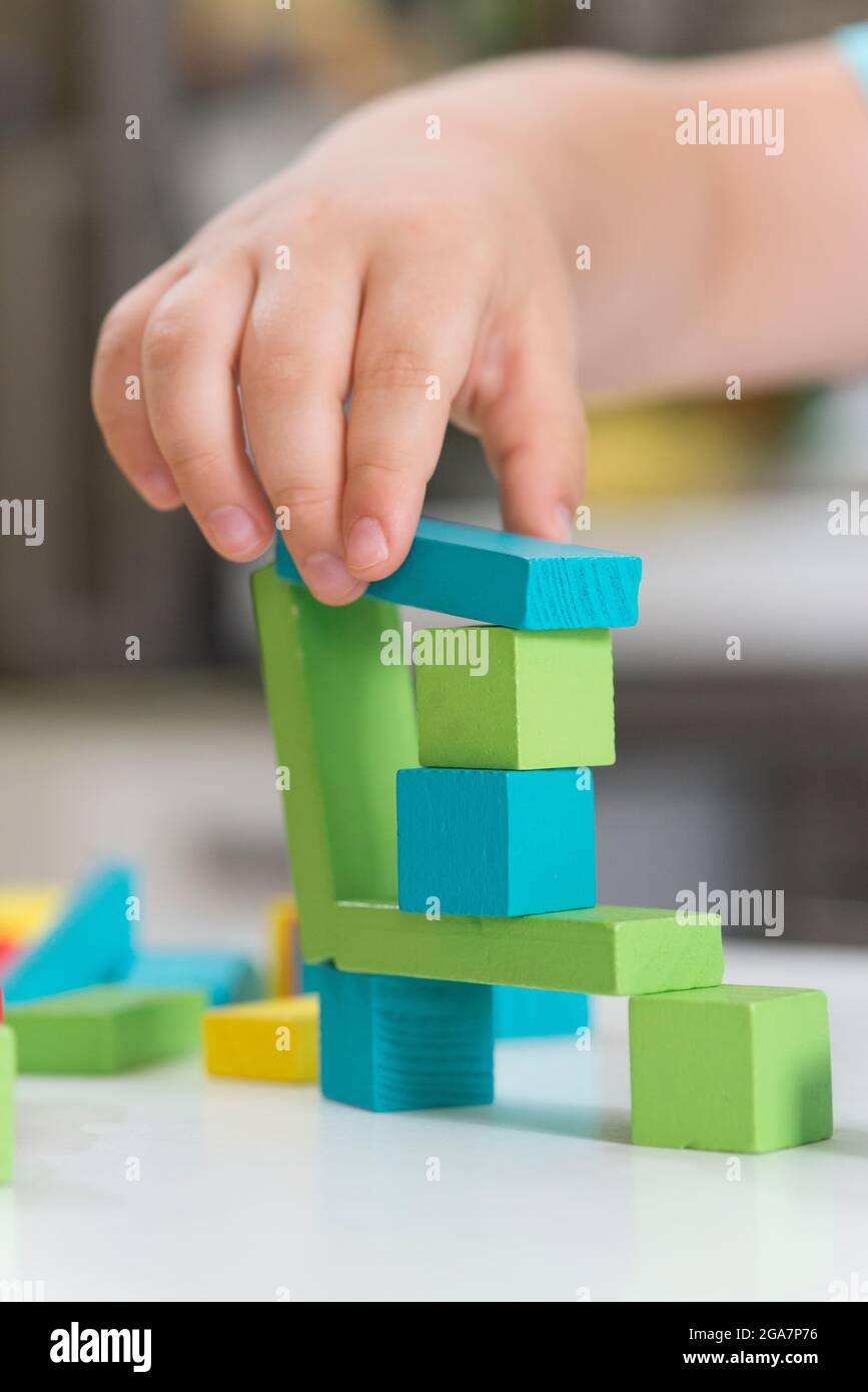 Boy Playing Building Wooden Blocks Stock Photo