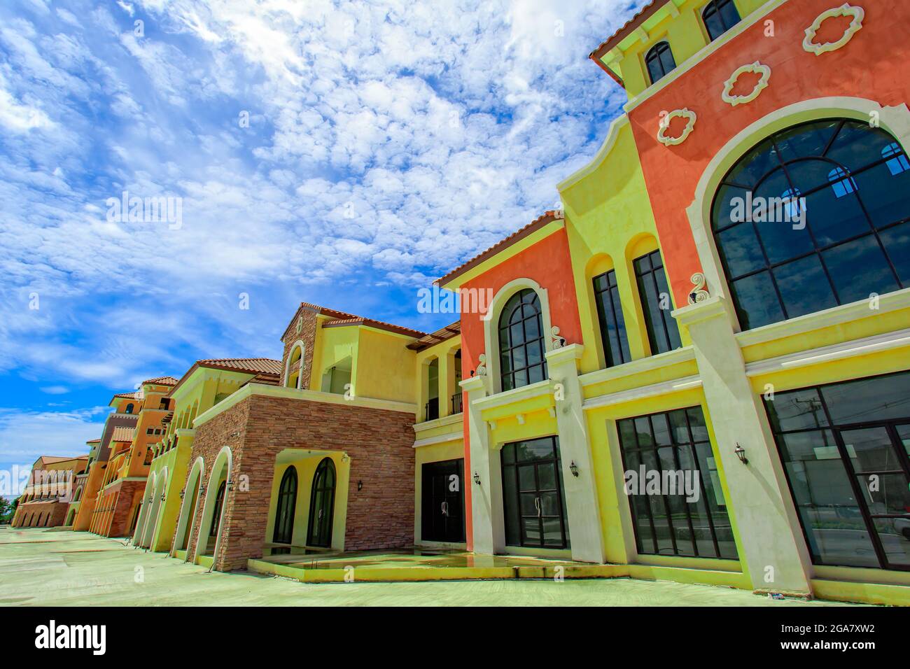 Vintage style buildings with blue sky and clouds in background Stock