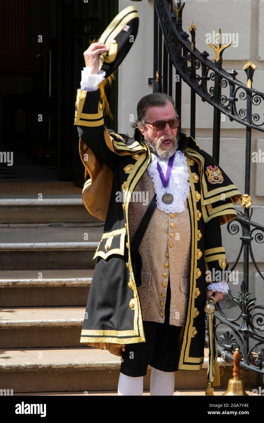 Lord Mayor calls while wearing a black Robe with gold braid on the steps ahead of Mansion House, St Helen's Square, York, North Yorkshire, United Kingdom. Stock Photo