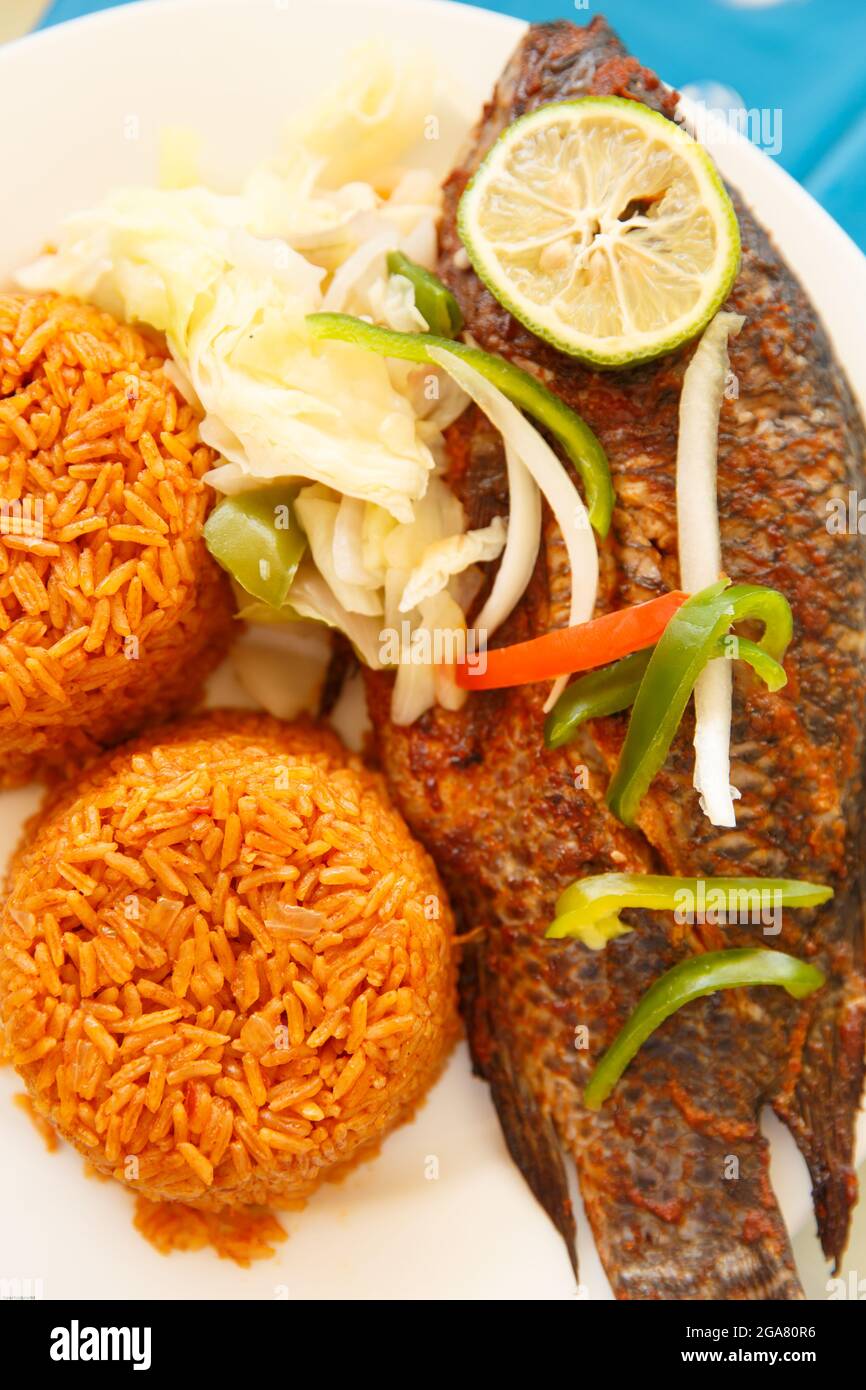 One of most popular food in Ghana, Jollof rice, serve with fish Stock