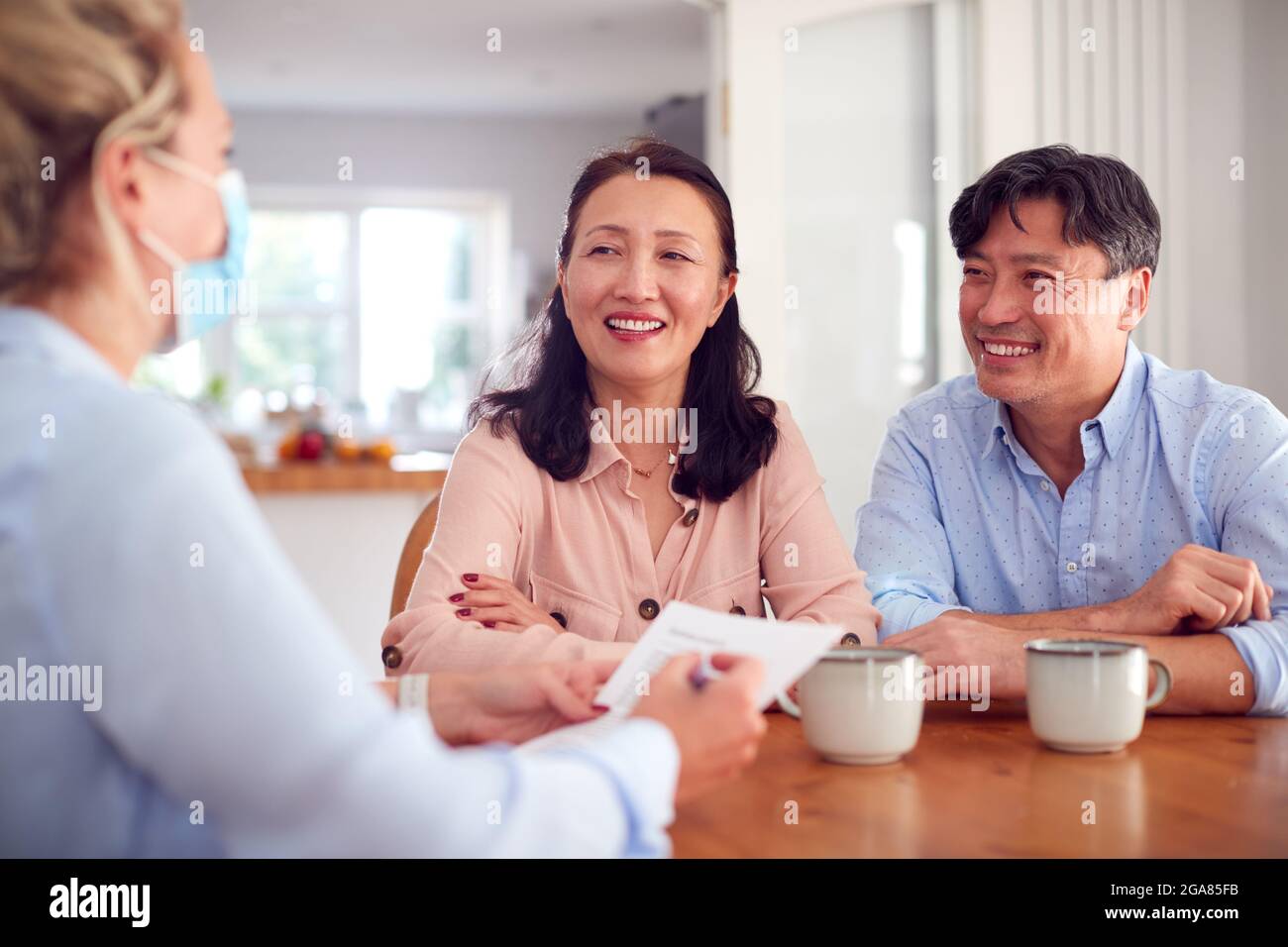 Happy asian couple during visit hi-res stock photography and images - Alamy