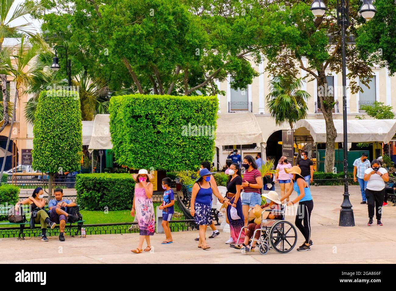 Mexican people in a park in downtown Merida, Mexico during the Covid-19 Global Pandemic Stock Photo