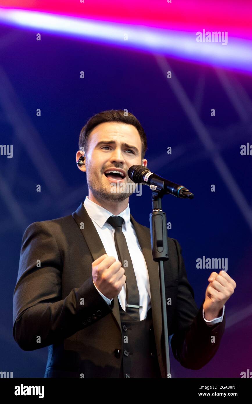 Michael Auger of Collabro performing live at a music festival at Maldon, Essex, UK in July 2021 after COVID restrictions end Stock Photo