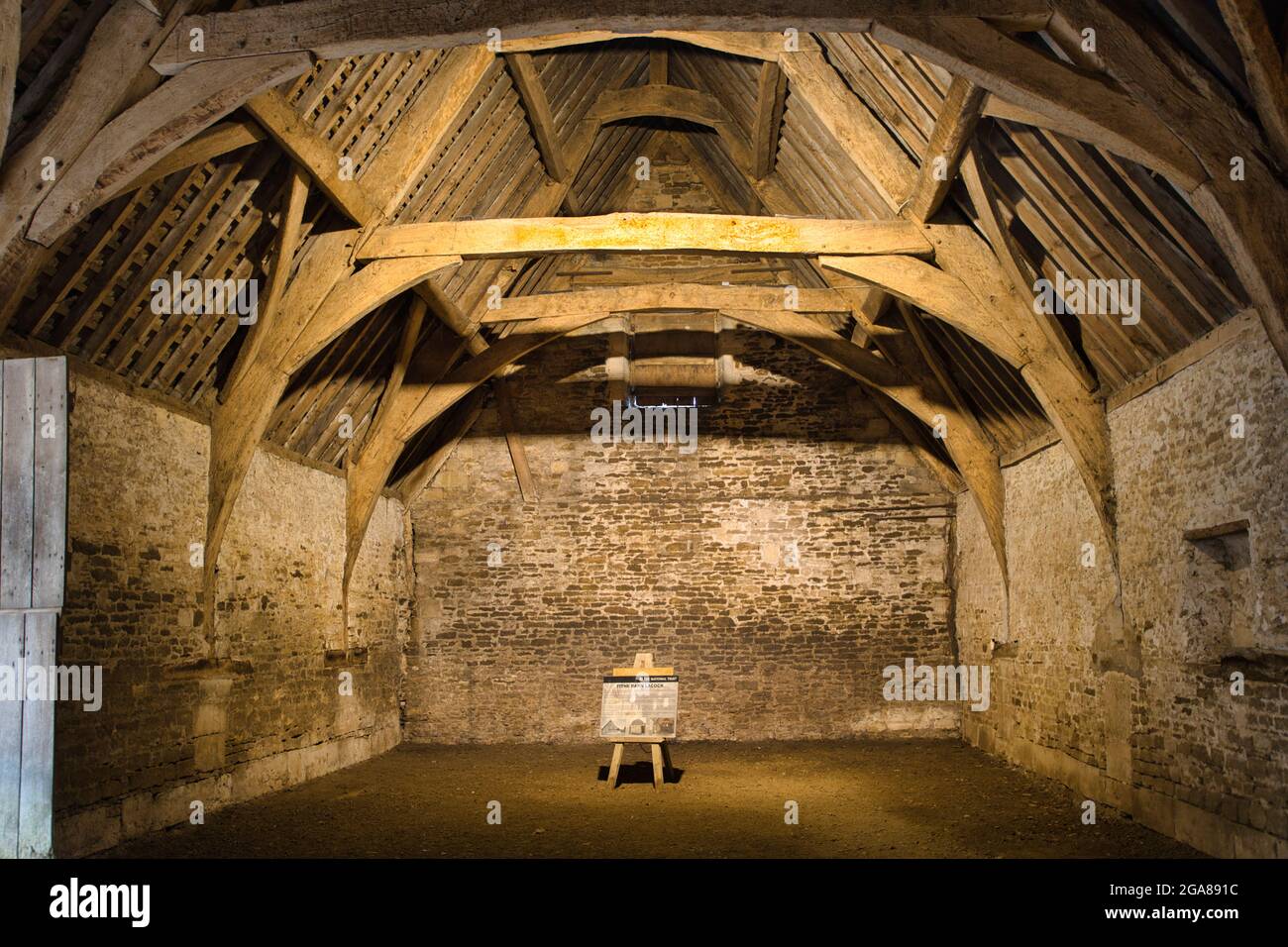 A genuine excellent example of the interior of a tithe barn in the village of Lacock, Wiltshire, England, UK Stock Photo