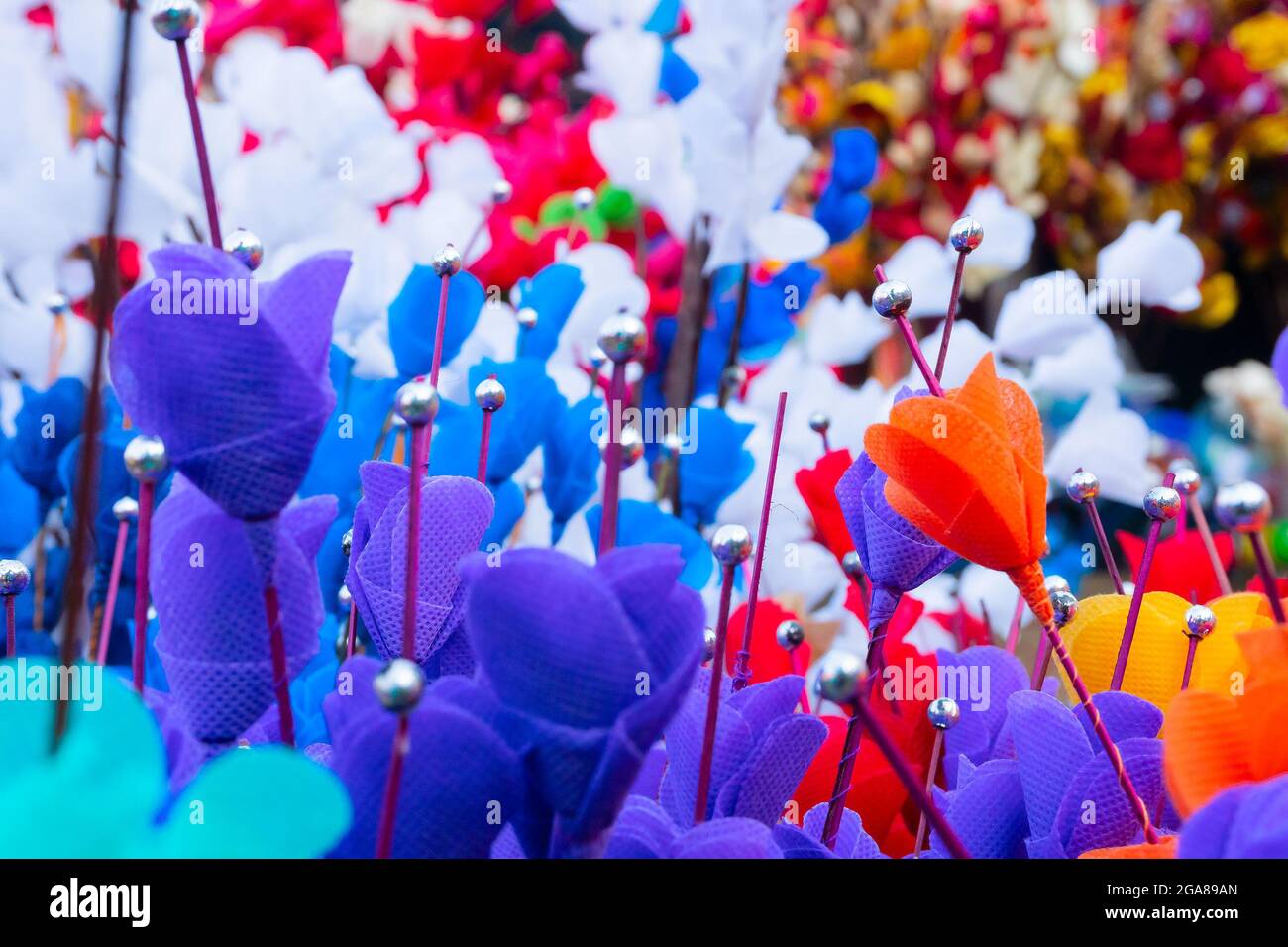 Colorful artificial flowers made out of colored sola, spongewood