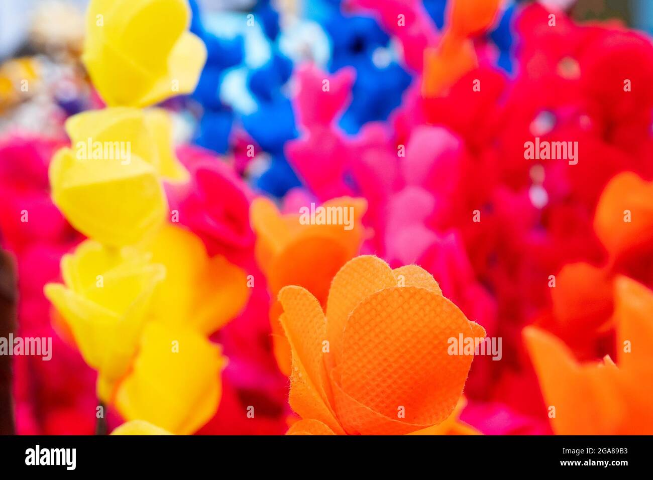 Colorful artificial flowers made out of colored sola, spongewood