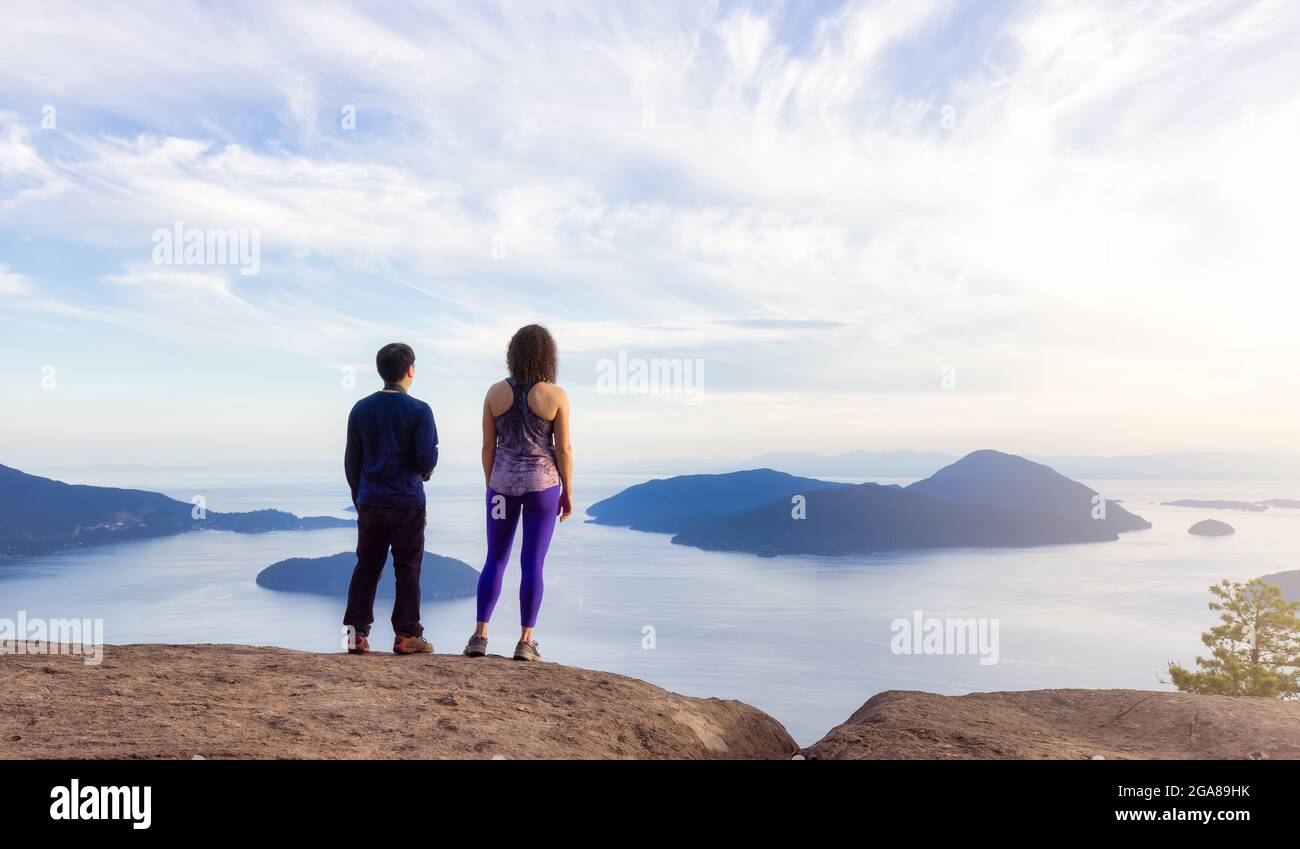 Friends hiking on top of Canadian Mountain Landscape Stock Photo - Alamy