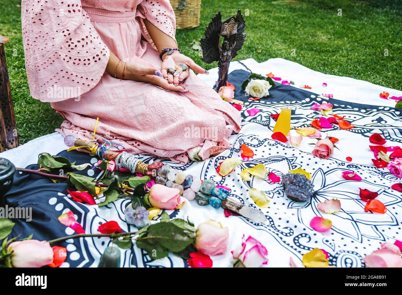Mexican woman hands holding healing crystals for holistic therapy in Latin America Stock Photo