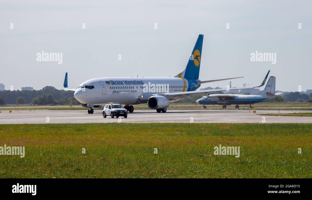 Ukraine, Odessa - July 16, 2021: Passenger aircraft UR-PSZ UKRAINE INTERNATIONAL AIRLINES BOEING 737-800 plane at Odesa airport. Travel and flights. Stock Photo