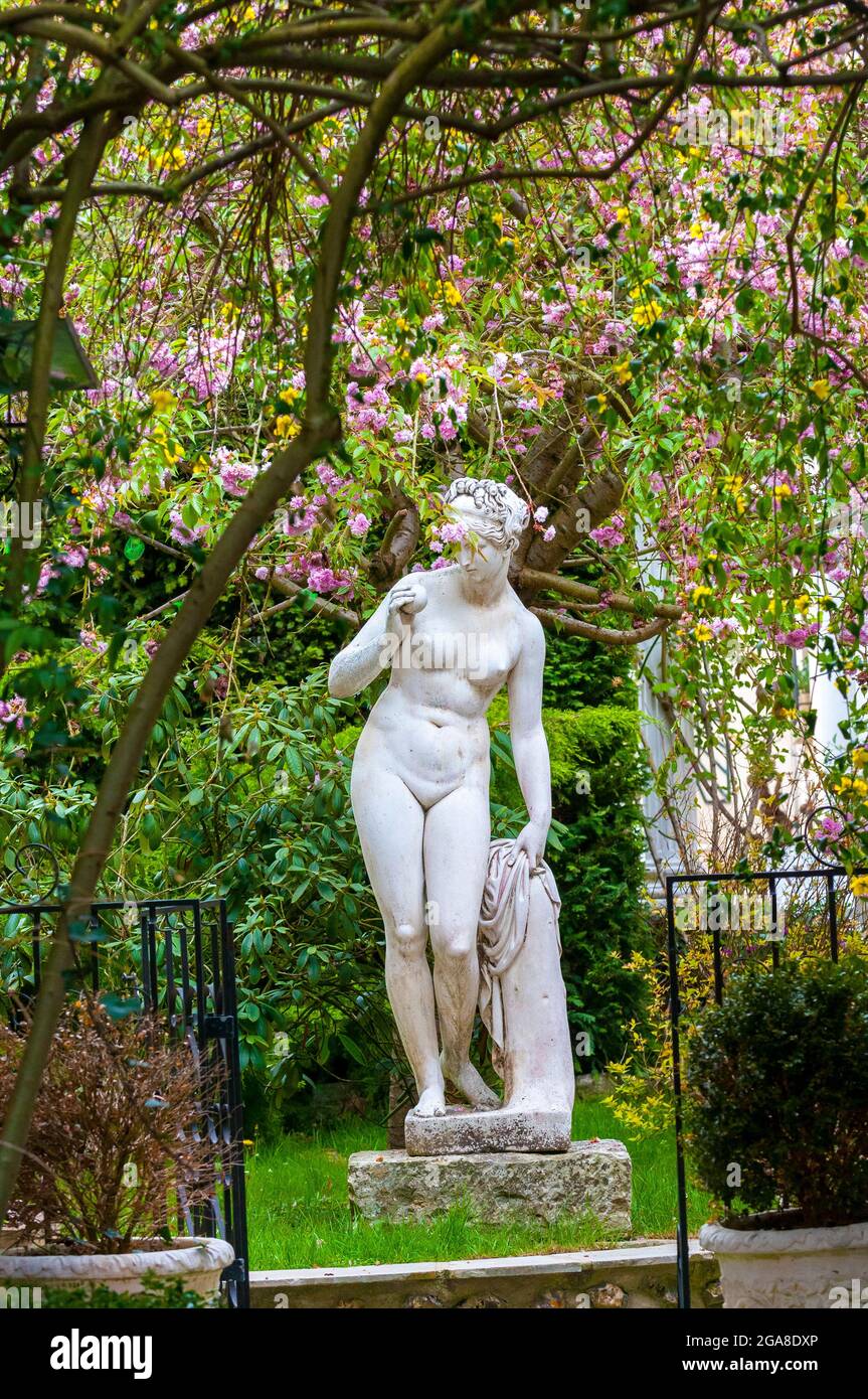nude female statue in garden,Giverny; Normandy; France; Eure; Europe; springtime Stock Photo