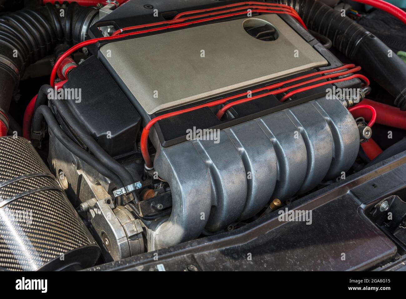 Open car hood. Engine and other motor parts Stock Photo Alamy
