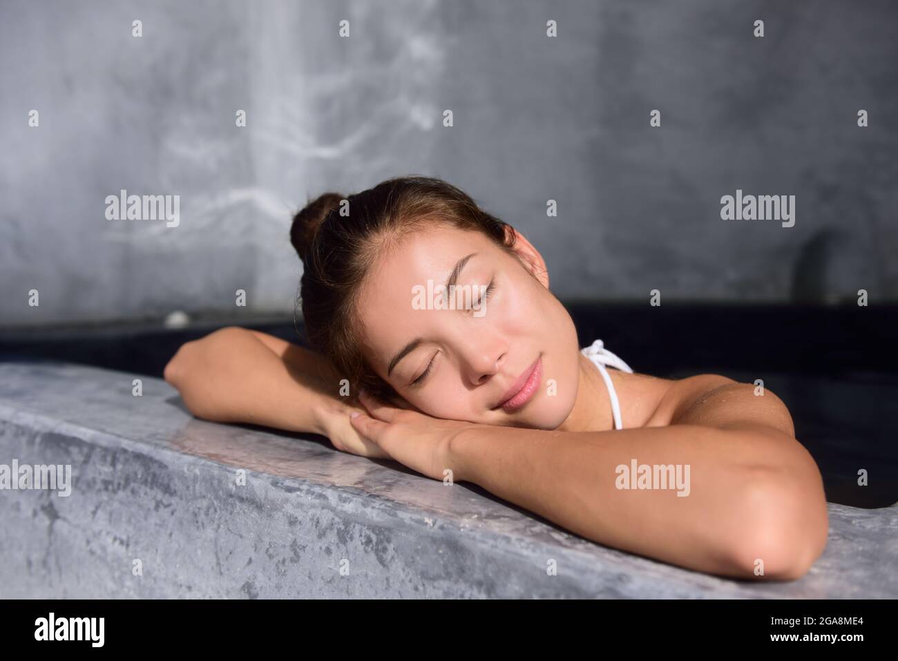 Beautiful Woman Relaxing In Jacuzzi Hot Tub At Spa Stock Photo