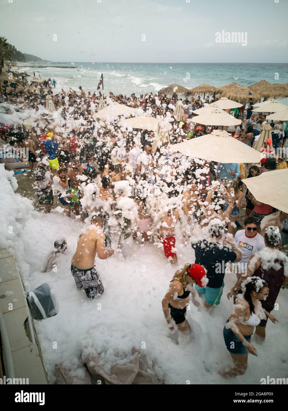 KALLITHEA HALKIDIKI, GREECE - May 05, 2019: A shot of people at a beach  party with soap bubbles in Greece Stock Photo - Alamy