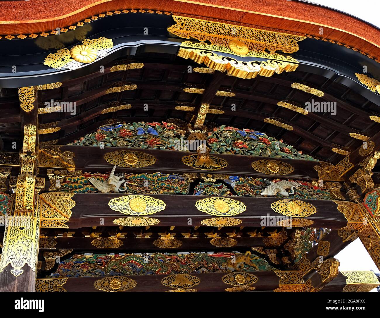 Nijo Castle entrance elaborately decorated with symbolic creatures, cranes, dragon, tiger. Stock Photo
