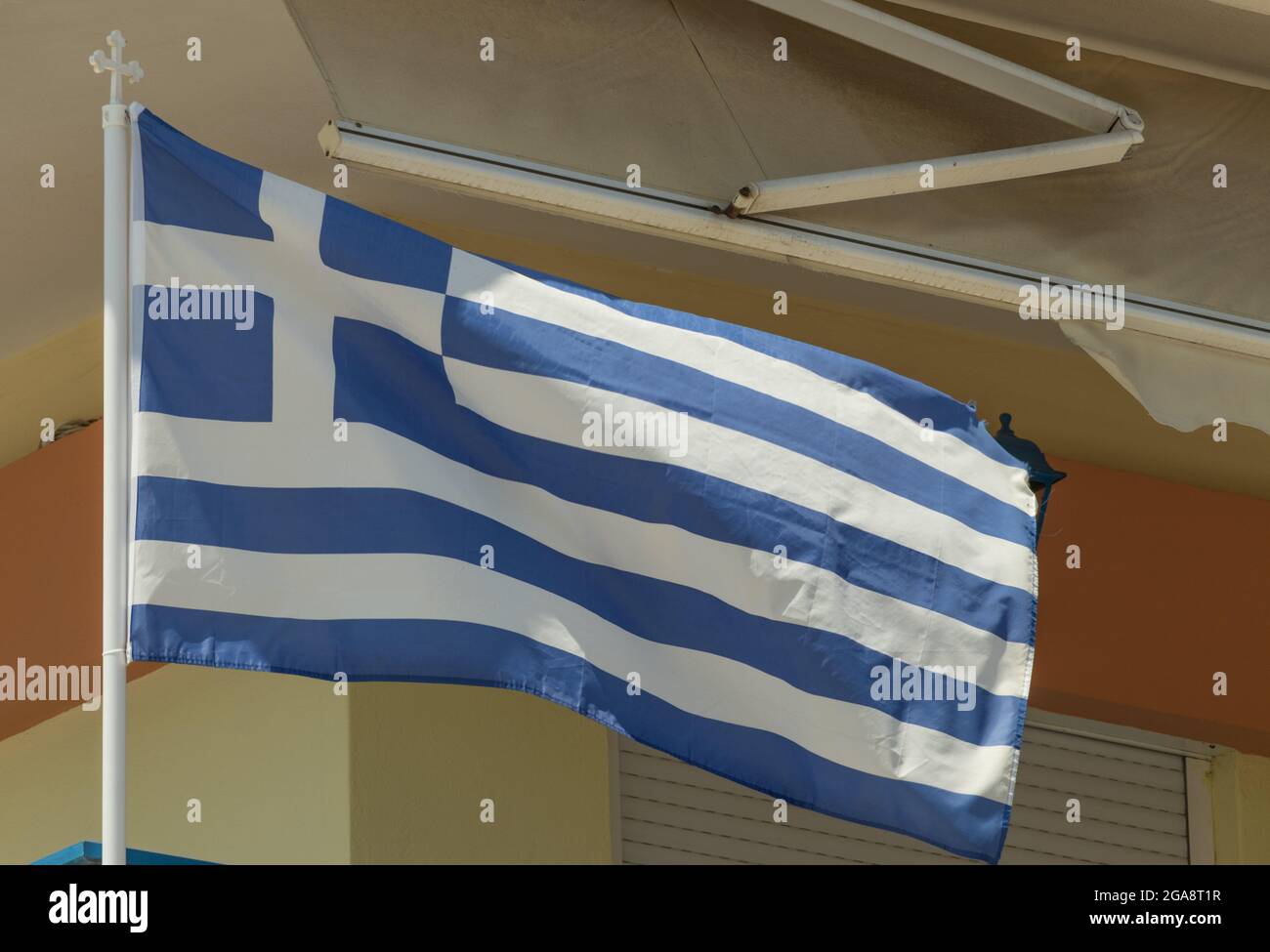 The Greek flag flutters in the wind Stock Photo