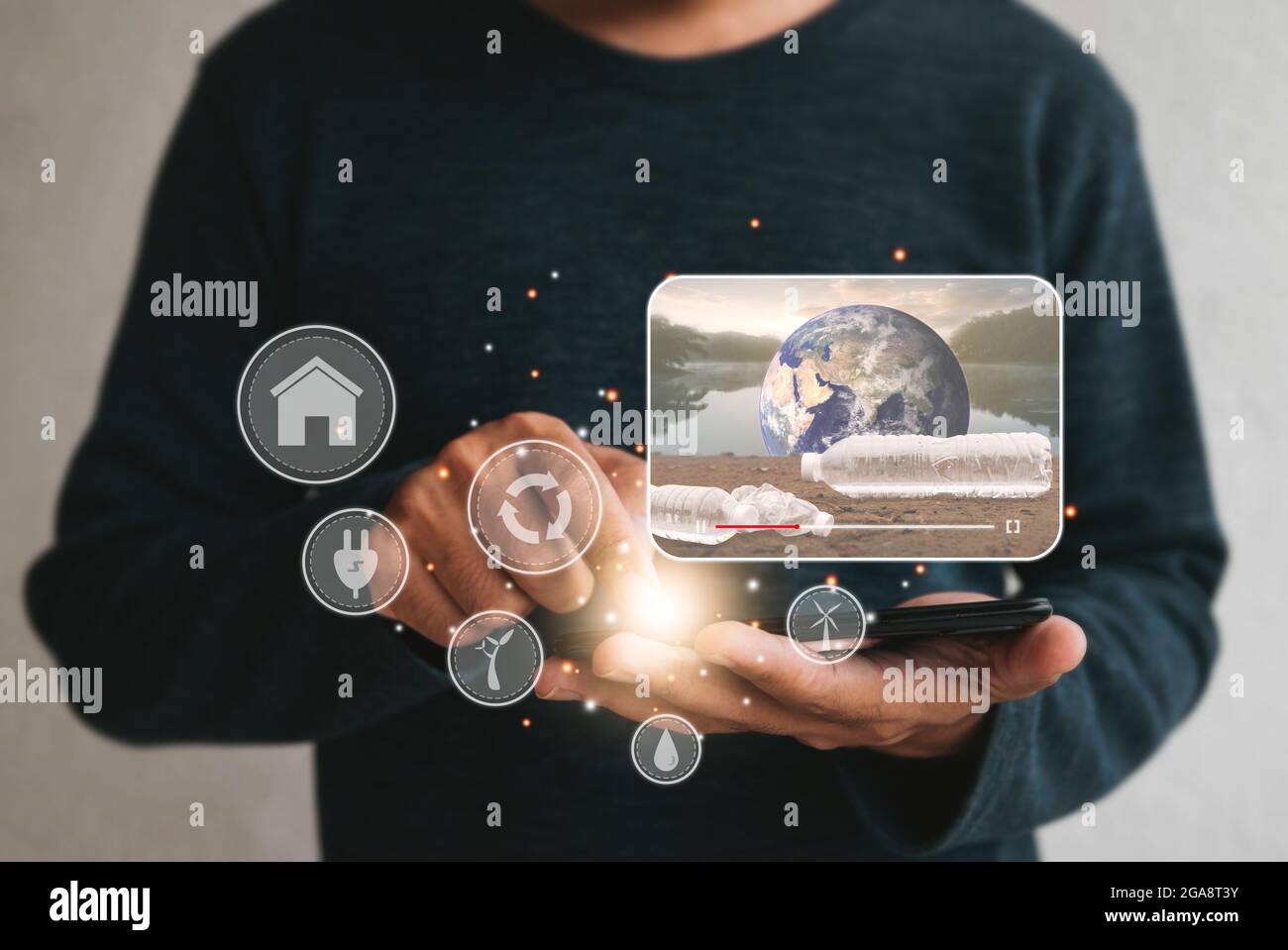 Close up hands holding smartphone. man using cellphone for watching video on internet about energy sources environmen.  Renewable green energy eco sav Stock Photo