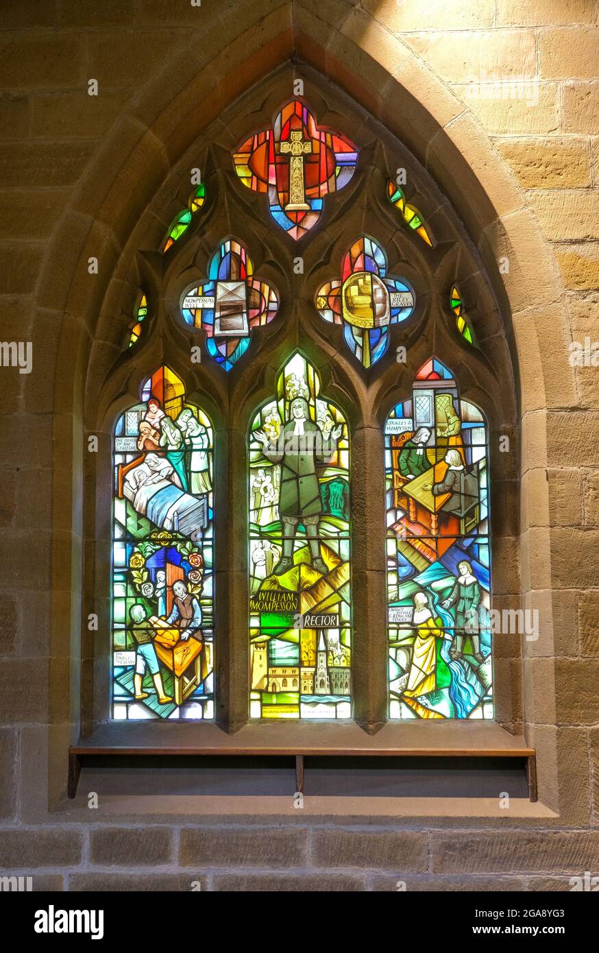 The modern stained glass window commemorating the sacrifices made by the inhabitants in the Derbyshire plague village of Eyam. Stock Photo