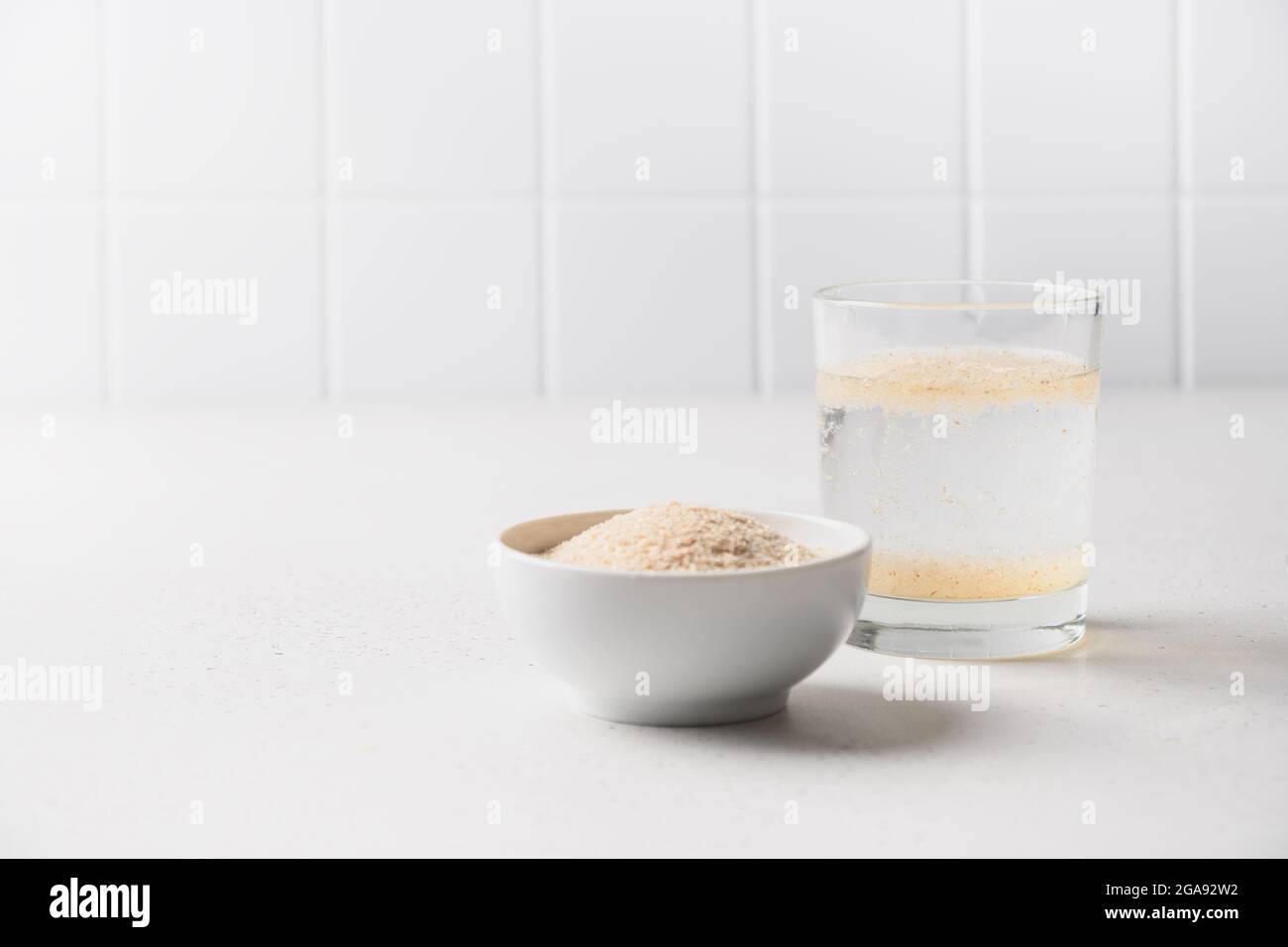 Psyllium husk and glass of water soluble fiber supplement for