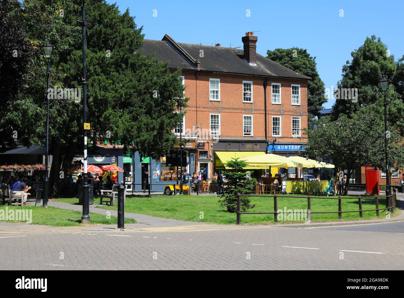 Restaurants and shops around the green at Winchmore Hill, a pretty