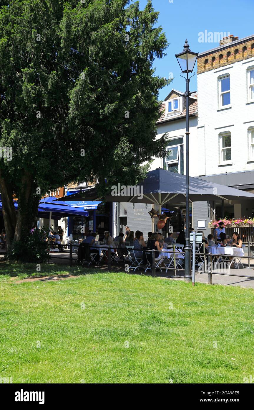 Restaurants and shops around the green at Winchmore Hill, a pretty