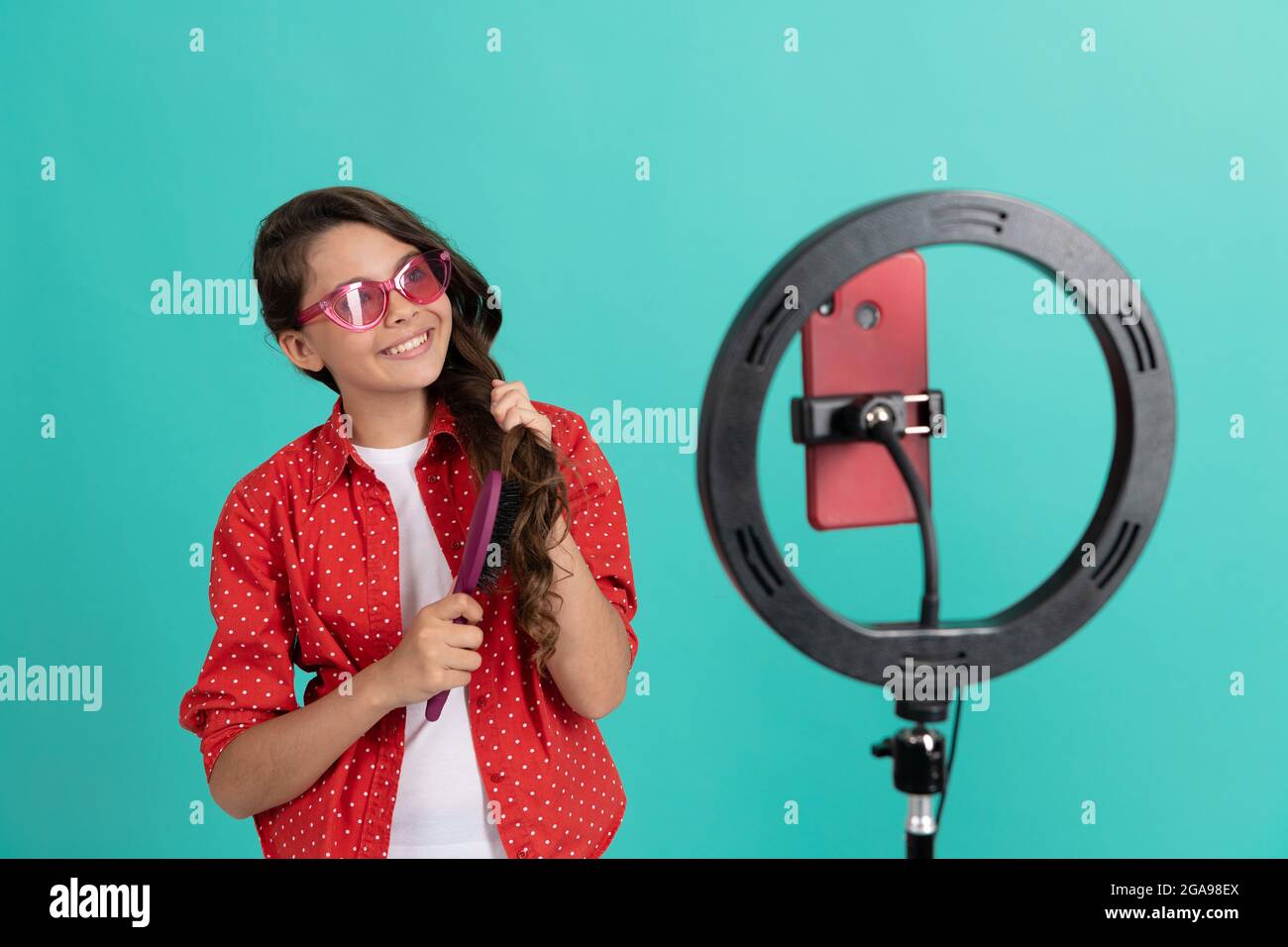 Teen girl brushing hair hi-res stock photography and images - Alamy