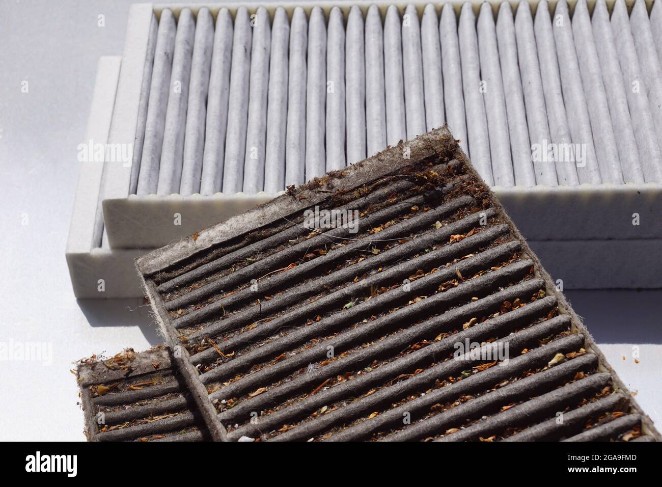 Comparison of two car cabin filters. Clean filter and used filter to be