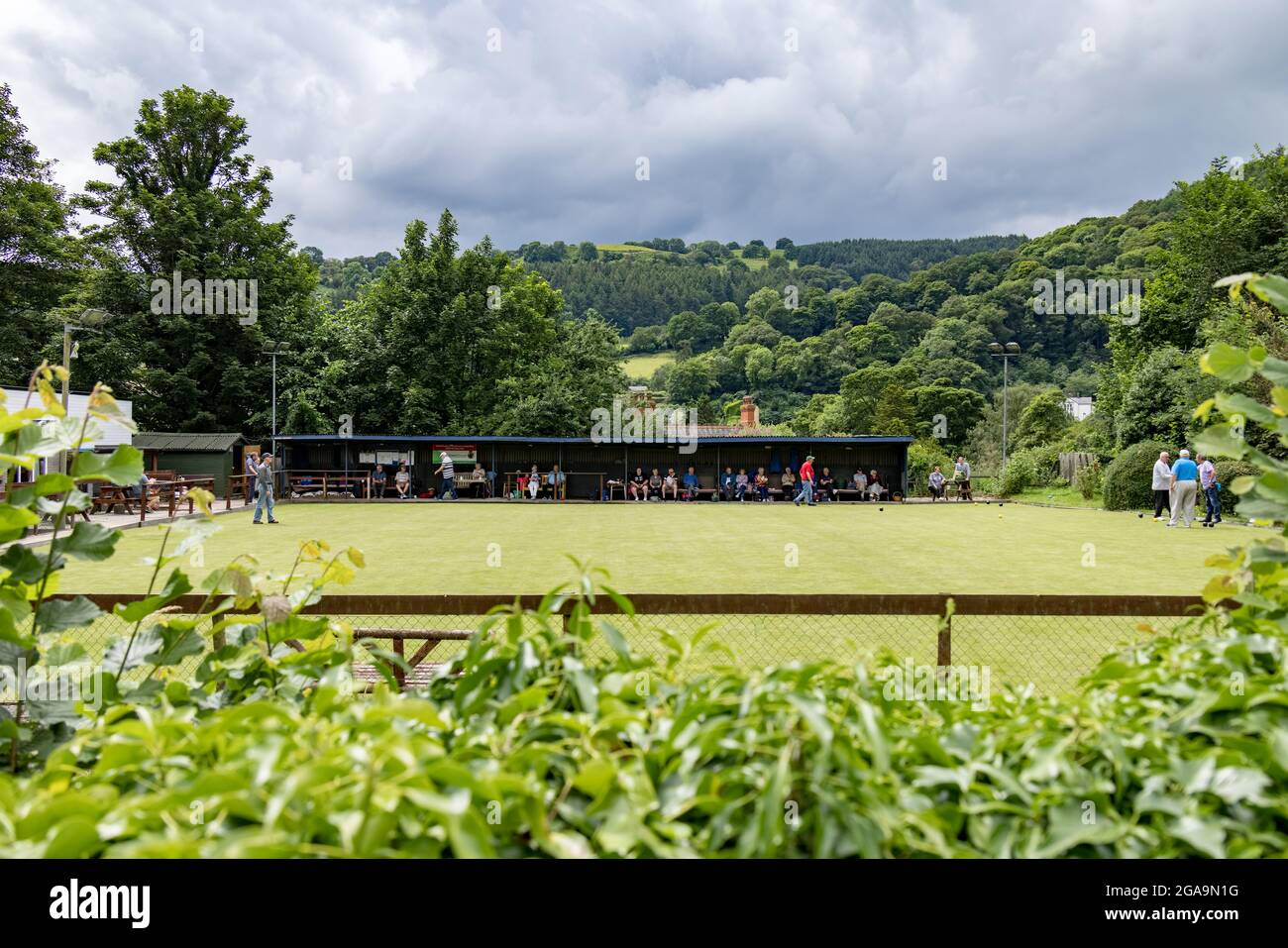 LLANGOLLEN, DENBIGHSHIRE, WALES - JULY 11 : People at the bowls club in Llangollen, Wales on July 11, 2021. Unidentified people Stock Photo