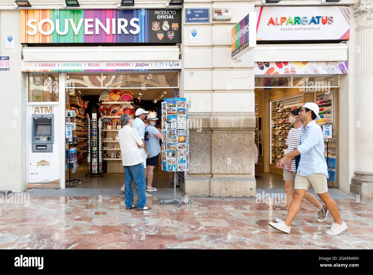 People seen at a souvenir shop in the Plaza del Ayuntamiento in