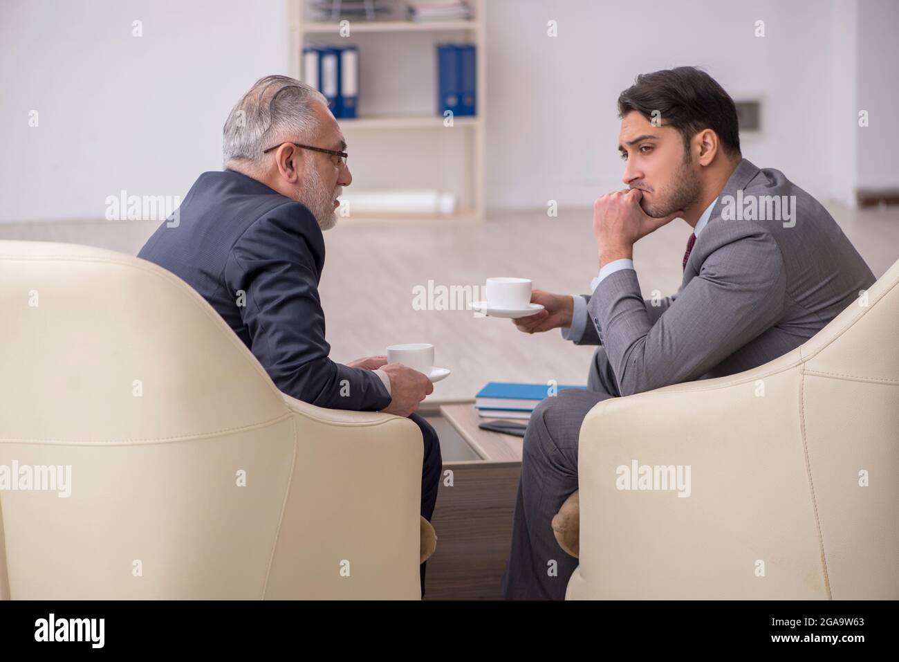 Two businessmen discussing project in the office Stock Photo