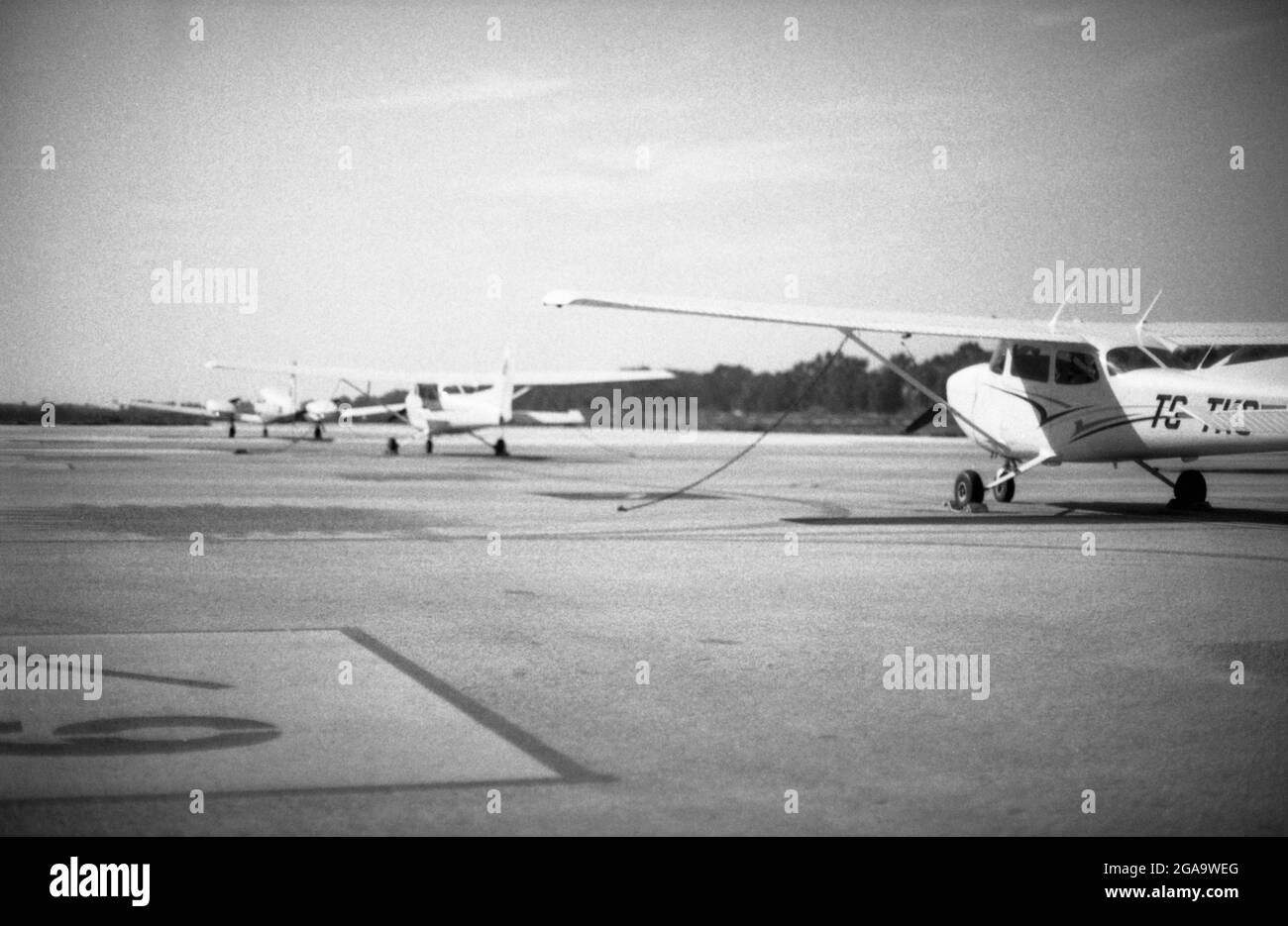 Izmir, Turkey - March 12, 2021: 80 Asa Black and white film scan image of Selcuk airport and three one engined planes on the runway. Selcuk Izmir Turk Stock Photo