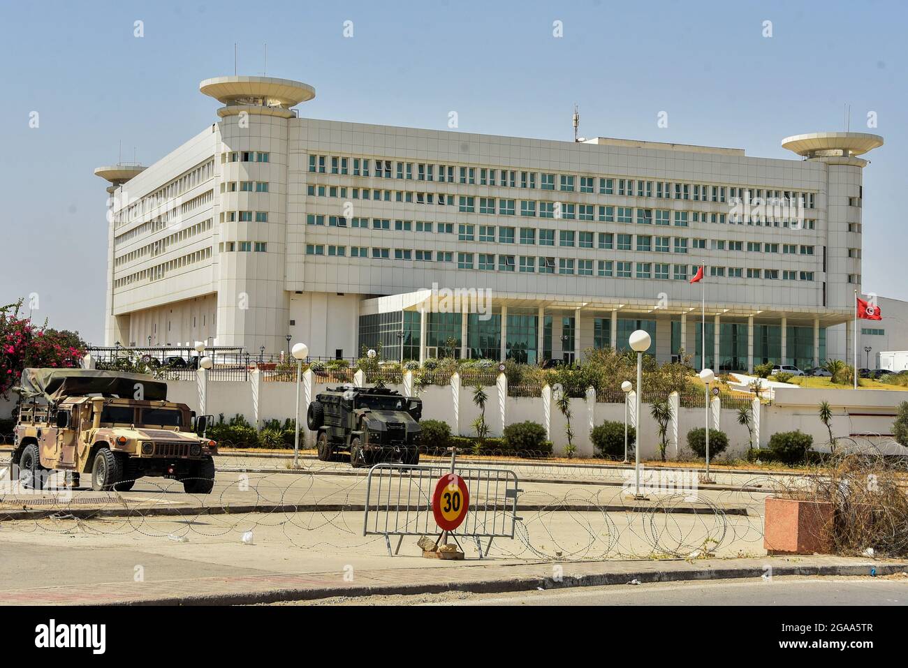 Tunis, Tunisia. 26th July, 2021. President Kais Saied has issued a  presidential decree announcing the dismissal of the CEO of the National  Television, Mohamed Lassa‚d Dahech.The Tunisian army is stationed in front